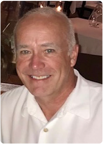 Tom Hipwell in a White Shirt, Smiling Headshot